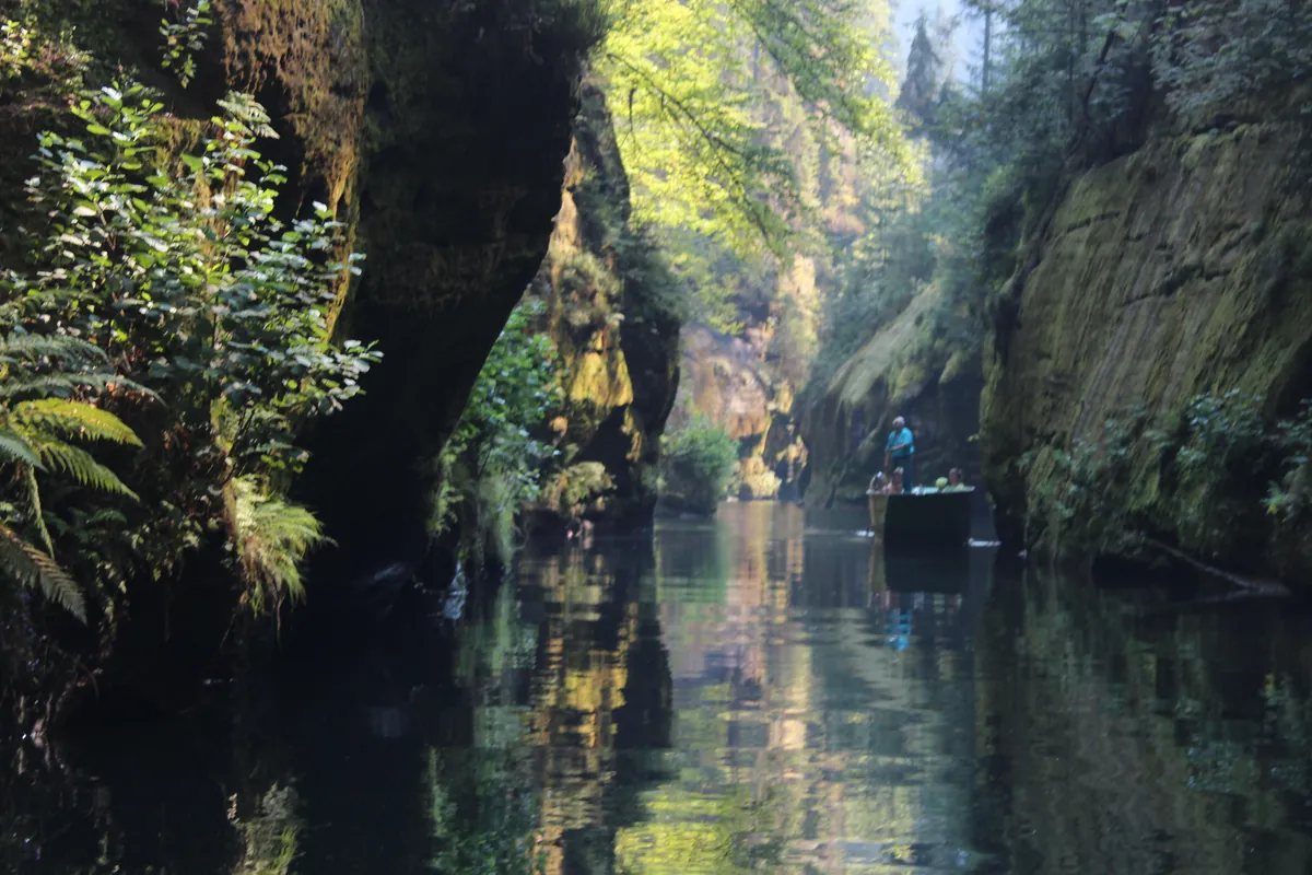 A poled boat on the Kamenice river in the Edmund's Gorge, Bohemian Switzerland